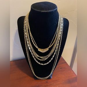 Bundle of gold tone chain necklaces